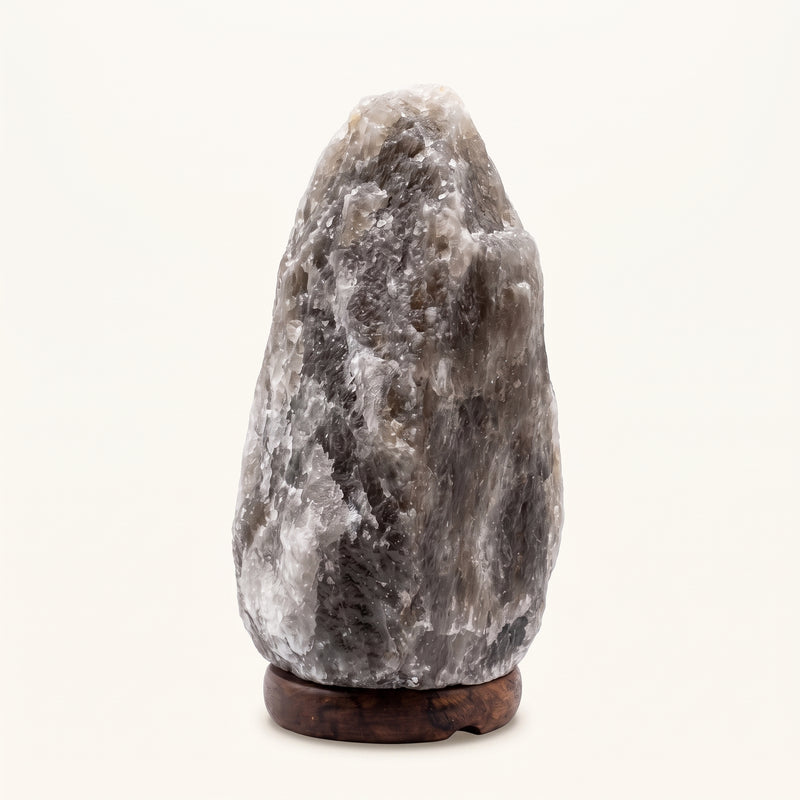 Rare Grey Himalayan salt lamp unlit on a wooden base