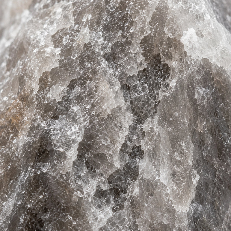 Close-up of the natural grey and white crystalline texture of a Rare Grey Himalayan salt lamp