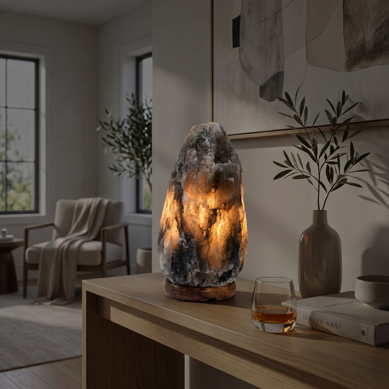 Rare Grey Himalayan salt lamp glowing warmly in a dim nighttime living room